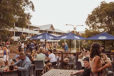 Sunset on the Caves House Beer Deck with Live Music