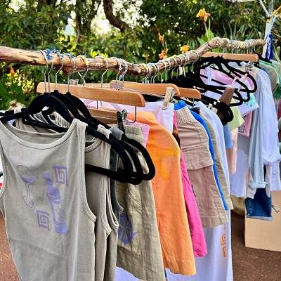 Clothes hanging on a rack at the Twilight Markets